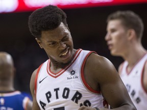 Toronto Raptors guard Kyle Lowry reacts after being caught by an elbow during Friday night's game against New York. (THE CANADIAN PRESS)