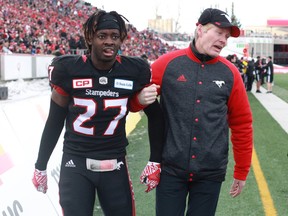 Calgary Stampeders' Tunde Adeleke leaves the field with an injury during the West final. (Jim Wells/Postmedia Network)