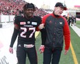 Calgary Stampeders' Tunde Adeleke leaves the field with an injury during the West final. (Jim Wells/Postmedia Network)