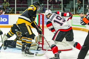 Travis Barron of the Ottawa 67’s tries to find the short side on Hamilton Bulldogs goalkeeper Nick Donofrio in yesterday’s game at TD Place. Graeme Ivory photo