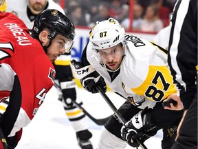 The Senators' Jean-Gabriel Pageau and Penguins captain Sidney Crosby.