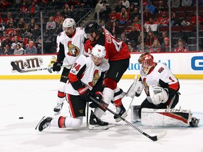 (l-R) Cody Ceci #5, Mark Borowiecki #74 and Mike Condon #1 of the Ottawa Senators defend against Blake Coleman #40 of the New Jersey Devils during the second period at the Prudential Center on October 27, 2017 in Newark, New Jersey.