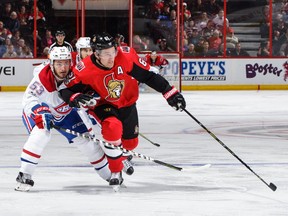 Mark Stone of the Senators pokes the puck past Victor Mete of the Canadiens in the second period of last Monday's game at Canadian Tire Centre.  Jana Chytilova/Freestyle Photography/Getty Images