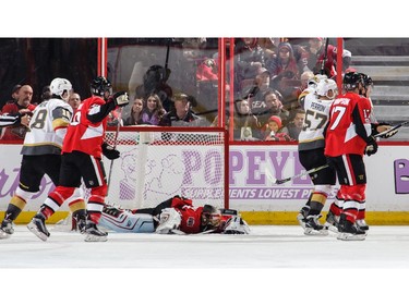Erik Haula of the Vegas Golden Knights (not pictured) scores a second-period goal as goaltender Craig Anderson of the Ottawa Senators lies on the ice.