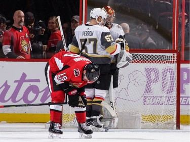 Maxime Lagace #33 of the Vegas Golden Knights celebrates his first career NHL win with teammate David Perron #57 as Derick Brassard #19 of the Ottawa Senators reacts.