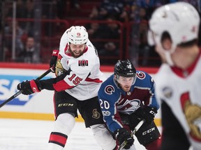 Zack Smith #15 of Ottawa Senators and Rocco Grimaldi #20 of Colorado Avalanche during the 2017 SAP NHL Global Series match between Ottawa Senators and Colorado Avalanche at Ericsson Globe on November 10, 2017 in Stockholm.