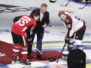 Daniel Alfredsson drops the puck for the ceremonial faceoff with Erik Karlsson of Ottawa Senators and Gabriel Landeskog of Colorado Avalanche on Saturday, Nov. 11, 2017, in Stockholm.