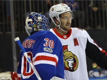 Mark Stone #61 of the Ottawa Senators talks to Henrik Lundqvist #30 of the New York Rangers after bumping into him during the first period during the first period at Madison Square Garden on November 19, 2017 in New York City.  (Photo by Bruce Bennett/Getty Images)