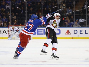 Matt Duchene #95 of the Ottawa Senators is checked by Jesper Fast #17 of the New York Rangers during the first period at Madison Square Garden on November 19, 2017 in New York City.  (Photo by Bruce Bennett/Getty Images)