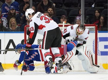 Fredrik Claesson #33 of the Ottawa Senators checks Jimmy Vesey #26 of the New York Rangers in the crease during the first period at Madison Square Garden on November 19, 2017 in New York City.  (Photo by Bruce Bennett/Getty Images)