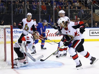Craig Anderson #41 and Erik Karlsson #65 of the Ottawa Senators defend the net during the second period against the New York Rangers at Madison Square Garden on November 19, 2017 in New York City.  (Photo by Bruce Bennett/Getty Images)