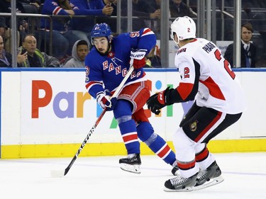 Mika Zibanejad #93 of the New York Rangers carries the puck against the Ottawa Senators during the second period at Madison Square Garden on November 19, 2017 in New York City.  (Photo by Bruce Bennett/Getty Images)