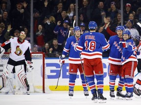 The New York Rangers celebrate a goal at 4:52 of the third period by Michael Grabner #40 (2nd from right) against the Ottawa Senators at Madison Square Garden on Saturday.