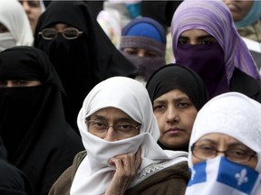 Montreal women wearing face coverings during a protest in Montreal.