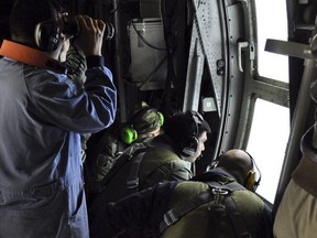 In this Tuesday, Nov. 21, 2017 photo released by the Argentine Navy on Nov. 22, members of the Argentine Air Force search for a missing submarine in the South Atlantic near Argentina's coast.