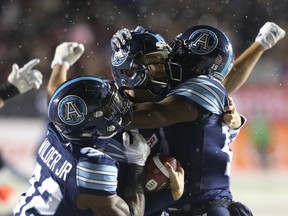 Argonauts players celebrates their Grey Cup win over the Stampeders on Sunday night in Ottawa. (Jean Levac/ Postmedia Network)