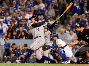 George Springer of the Houston Astros hits an infield single during the seventh inning against the Los Angeles Dodgers in Game 6 of the 2017 World Series at Dodger Stadium on October 31, 2017 in Los Angeles. (Harry How/Getty Images)