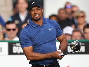 This file photo taken on February 1, 2017 shows Tiger Woods of the United States playing a shot during the Dubai Desert Classic golf tournament at the Emirates Golf Club in Dubai