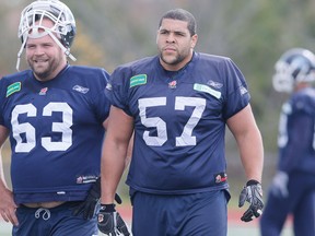 Tyler Holmes, right, during Toronto Argos practice on Oct. 10, 2013