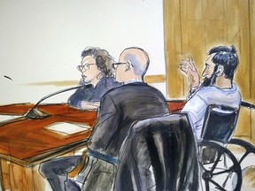 In this courtroom drawing, defendant Sayfullo Saipov, right, addresses the court during his arraignment on federal terrorism charges, Wednesday, Nov. 1, 2017, at Manhattan Federal Court in New York.