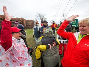 Striking college teachers react to the news that the latest offer from the province has been rejected by their fellow union members after voting for the last three days. Photo Wayne Cuddington/ Postmedia
Wayne Cuddington, Postmedia