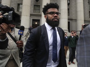 Dallas Cowboys NFL football star Ezekiel Elliott walks out of federal court, Thursday, Nov. 9, 2017, in New York. Elliott's lawyers argued before a Manhattan federal appeals court on whether the Cowboys running back should be allowed to play while three judges decide the fate of his six-game suspension for alleged domestic violence. (AP Photo/Julie Jacobson)
