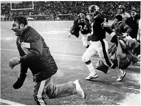Head coach George Brancato and members of the Rough Riders celebrate their 23-20 victory over the Rough Riders in the 1976 Grey Cup game.