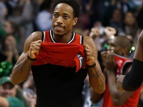 Raptors' DeMar DeRozan lifts up his jersey after missing a shot in the final seconds of their 95-94 loss to the Celtics in Boston, on Sunday, Nov. 12, 2017. (Winslow Townson/AP Photo)