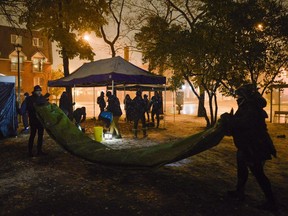 Volunteers and organizers of OPO (Overdose Prevention Ottawa) pack it in on the last night of the popup injection site at Raphael Brunet park on Thursday, Nov. 9, 2017. (James Park for Postmedia)