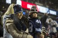 Fans didn't let a little snow stop their excitement at the 105th Grey Cup at TD Place Stadium on Sunday. (Ashley Fraser/Postmedia Network)