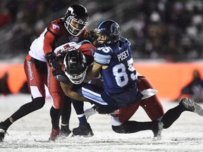 Toronto Argonauts wide receiver DeVier Posey (85) gets tackled by Calgary Stampeders defensive back Shaquille Richardson (35) during second half CFL football action in the 105th Grey Cup on Sunday, November 26, 2017 in Ottawa. THE CANADIAN PRESS/Nathan Denette ORG XMIT: ajw167
Nathan Denette,