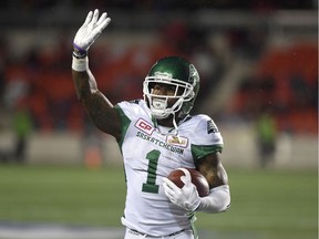 Roughriders defensive back Jovon Johnson waves to Redblacks fans after making a game-clinching interception in a contest on Sept. 29. THE CANADIAN PRESS/Justin Tang