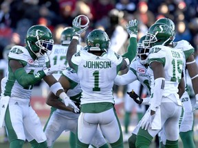 Saskatchewan Roughriders' Jovon Johnson (1) celebrates with teammates after his interception during second half Eastern semifinal CFL action against the Ottawa Redblacks, in Ottawa on Sunday, Nov. 12, 2017. THE CANADIAN PRESS/Justin Tang