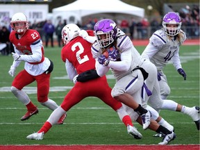 Western's Cederic Joseph scores a touchdown against the Axemen on Saturday. THE CANADIAN PRESS/Ted Pritchard