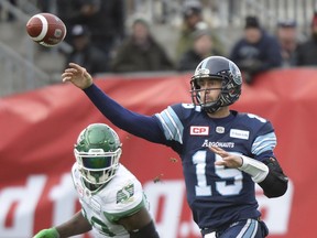 Toronto Argonauts quarterback Ricky Ray (15) fires a pass against the Saskatchewan Roughriders during the first half of the CFL Eastern final, Sunday.