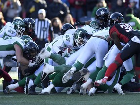 Roughriders quarterback Vernon Adams Jr. pushes into the endzone for a touchdown against the Redblacks on Sunday.  (Justin Tang/The Canadian Press)