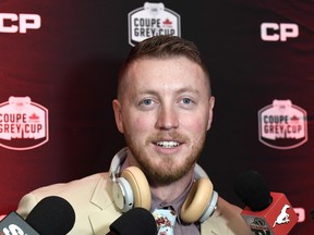 Calgary Stampeders quarterback Bo Levi Mitchell speaks to reporters at the airport in Ottawa, ahead of his team's Grey Cup match against the Toronto Argonauts.