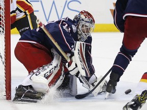 Columbus Blue Jackets' Sergei Bobrovsky, of Russia, makes a save against the Calgary Flames during the third period of an NHL hockey game Wednesday, Nov. 22, 2017, in Columbus, Ohio. The Blue Jackets beat the Flames 1-0 in overtime.