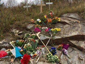 Crosses, flowers and mementoes mark the location of a single-car crash on Calabogie Road near Burnstown that killed Brandon Hanniman and Alex Paquette, both 18.