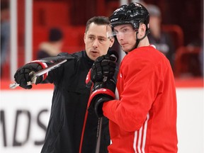 Head coach Guy Boucher of the Ottawa Senators gives instructions to Matt Duchene.