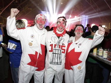 Kingston fans, left to right, Kevin Delph, Aaron Delph and Kathi Deplanche from Kingston join in the fun on Saturday evening. David Kawai/Postmedia