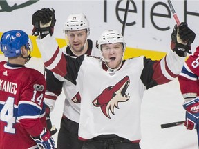 Arizona's Christian Fischer, front, celebrates his goal against the Canadiens in Montreal on Thursday night. The Coyotes won that contest 5-4. THE CANADIAN PRESS/Graham Hughes