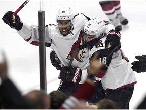 Arizona Coyotes' Anthony Duclair (10) celebrates his game winning goal against the Ottawa Senators with Max Domi (16) during overtime NHL hockey action in Ottawa, Saturday. THE CANADIAN PRESS/Justin Tang