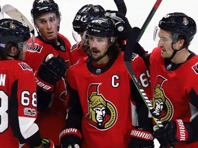 A subdued Ottawa Senators captain, Erik Karlsson, is congratulated after scoring late against the Vegas Golden Knights.