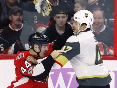 Vegas Golden Knights defenceman Luca Sbisa (47) fights Ottawa Senators centre Jean-Gabriel Pageau.