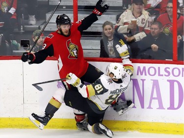 Ottawa Senators defenceman Fredrik Claesson (33) collides with Vegas Golden Knights centre Jonathan Marchessault.