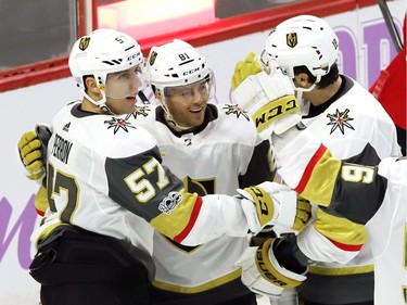 Vegas Golden Knights centre Jonathan Marchessault (81) celebrates his goal with David Perron (57) and James Neal.
