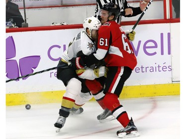 Ottawa Senators right wing Mark Stone (61) collides with Vegas Golden Knights defenceman Brayden McNabb.