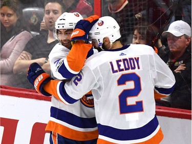 The Islanders' Jordan Eberle celebrates his third-period goal with Nick Leddy. It turned out to be the game-winner against the Senators. THE CANADIAN PRESS/Justin Tang