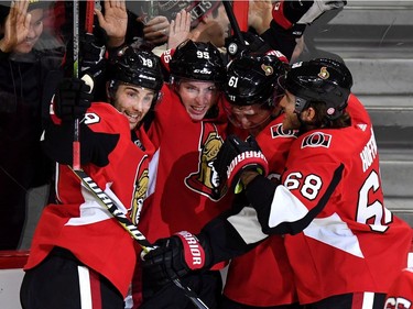 The Senators' Mat Duchene, second from left, celebrates his first goal with his new team with Derick Brassard (19), Mark Stone (61) and Mike Hoffman (68) during the third period. THE CANADIAN PRESS/Justin Tang